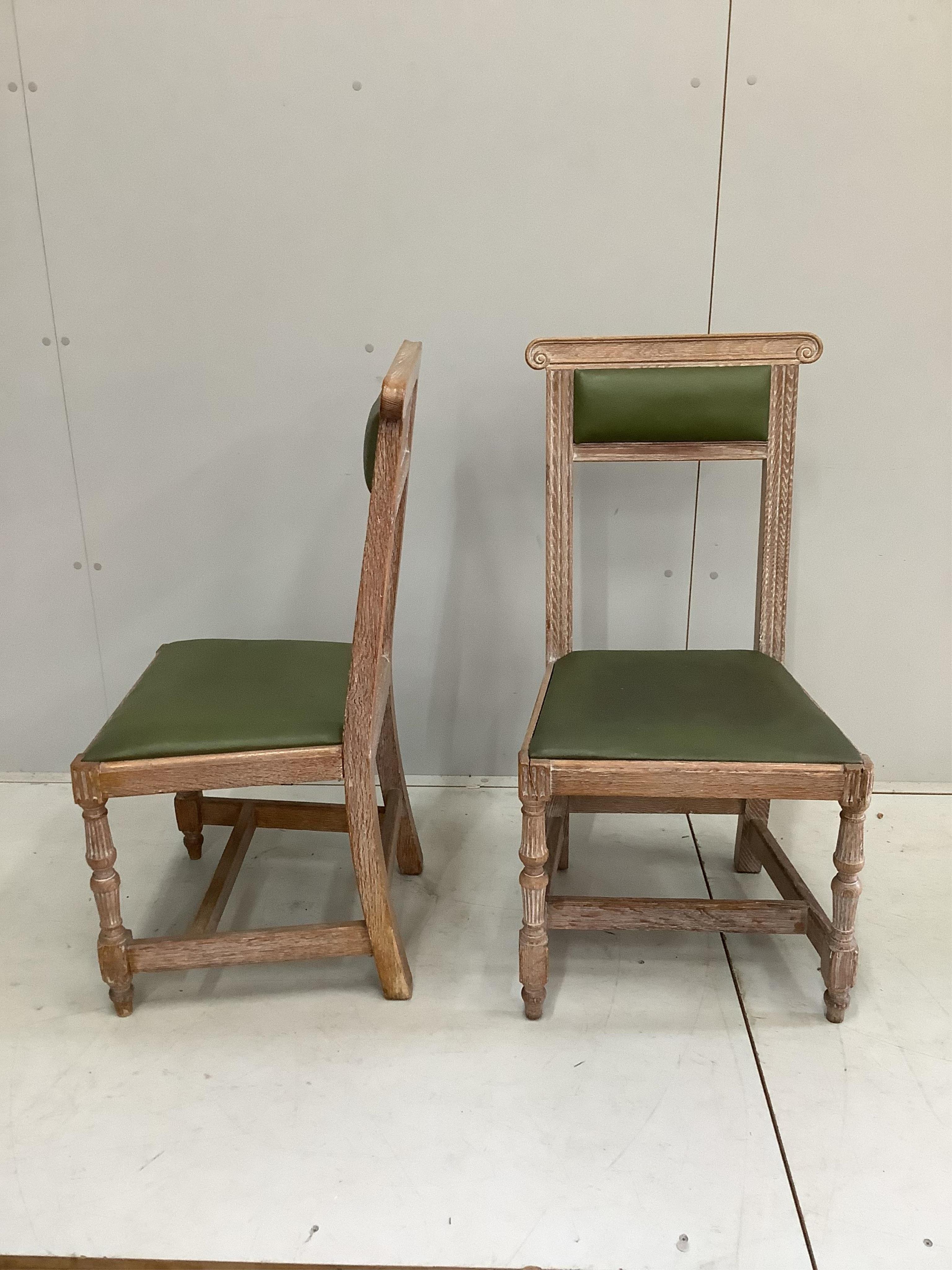 A pair of limed oak dining chairs, width 46cm, height 95cm. Condition - fair